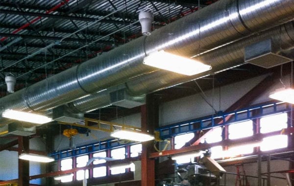 air pear fans hanging from ceiling of workshop